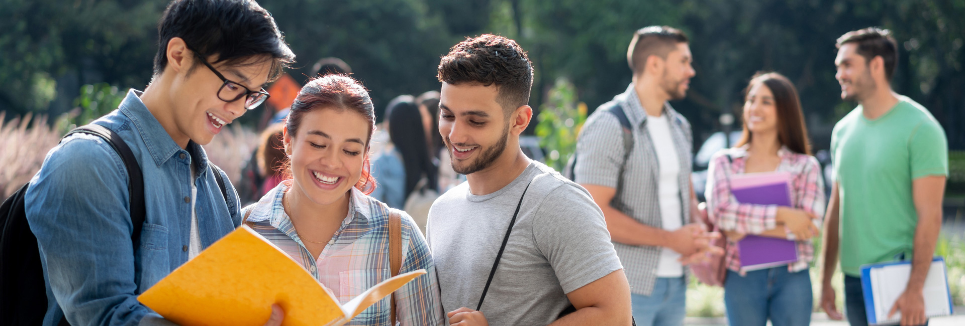 Group of students talking outside of campus