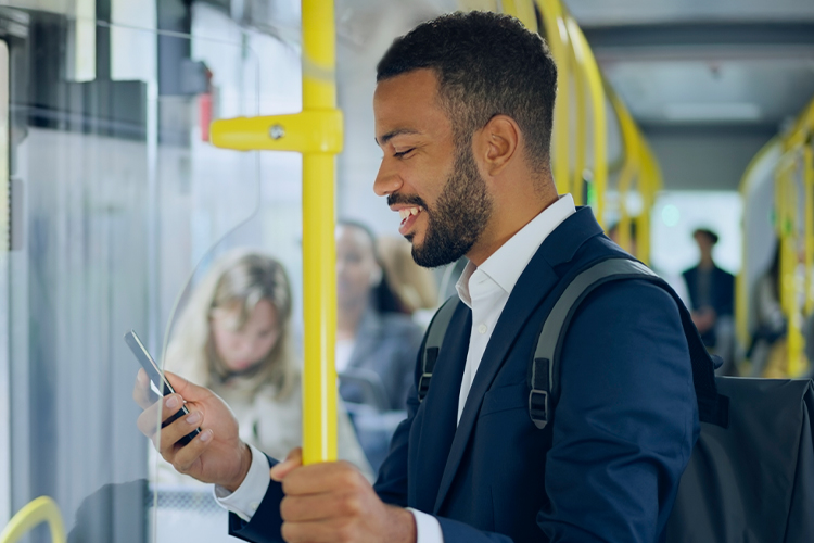 Man using his phone while riding the train