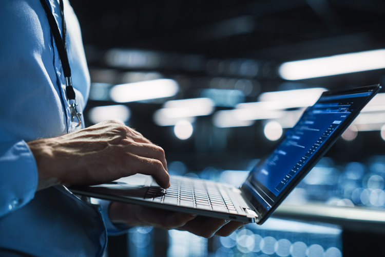 Person using laptop closeup
