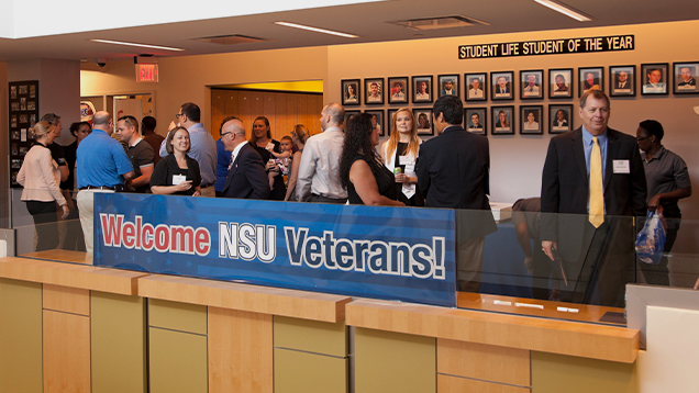 Group of NSU veterans talking during an event